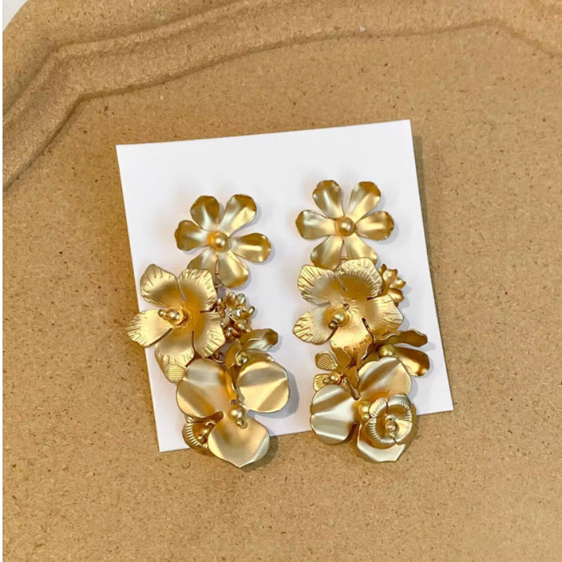 Long floral gold earrings