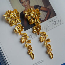 Load image into Gallery viewer, Long gold-tone floral earrings
